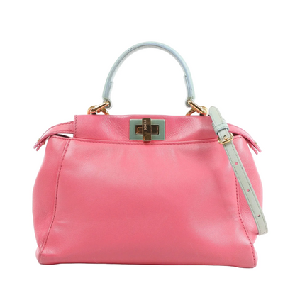 Fendi Peekaboo Mini handbag in pink leather with light blue top handle and strap, gold-tone hardware, twist-lock closure, and structured silhouette against a white background.