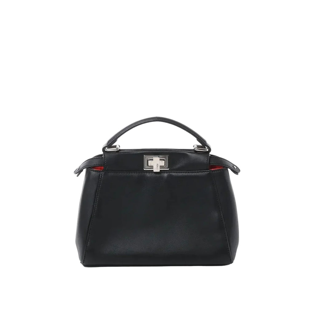 Front view of black leather top-handle handbag with silver-tone twist-lock clasp and subtle red interior detail on white background.