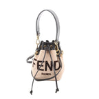 Beige Fendi Mon Tresor mini bucket bag with black leather trim, drawstring closure, FENDI ROMA lettering, top handle and crossbody strap, front view on white background.