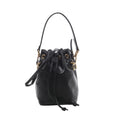 Black Fendi Mon Tresor Mini leather bucket bag with drawstring closure, shoulder and crossbody straps, and gold-tone eyelet and clasp hardware.