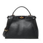 Front view of Fendi Peekaboo Regular 2Way Handbag 8BN290 in smooth black leather with top handle, adjustable shoulder strap, and gold-tone twist-lock closure, displayed against a white background.