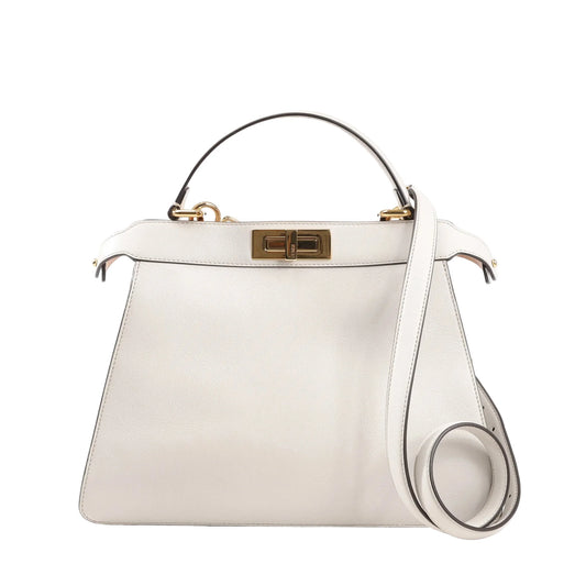 Front view of a Fendi Peekaboo Medium 8BN321 handbag in light gray leather, featuring a structured silhouette, gold-tone turn-lock closure, top handle, and detachable shoulder strap.