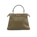 Fendi Peekaboo ISeeU Medium handbag in olive green leather with top handle and gold-tone turn-lock closure on white background