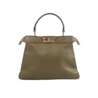 Fendi Peekaboo ISeeU Medium handbag in olive green leather with top handle and gold-tone turn-lock closure on white background