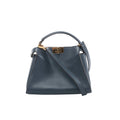 Front view of Fendi Peekaboo Essentially blue leather handbag with a curved top handle, matching shoulder strap and gold-tone turn-lock closure.
