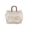 Fendi Sunshine Medium white leather tote bag with tortoiseshell-effect top handles, gold-tone hardware, FENDI ROMA logo and shoulder strap.