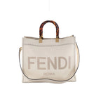 Fendi Sunshine Medium white leather tote bag with tortoiseshell-effect top handles, gold-tone hardware, FENDI ROMA logo and shoulder strap.