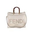 Fendi Sunshine Medium white leather tote bag with tortoiseshell-effect top handles, gold-tone hardware, FENDI ROMA logo and shoulder strap.