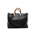 Front view of Fendi Sunshine Medium black leather tote with a raised FF pattern, tortoiseshell-effect top handles, gold-tone fittings and shoulder strap.