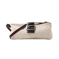 Fendi Baguette shoulder bag in beige Zucca canvas with dark brown leather trim, slim adjustable strap and silver-tone FF buckle.
