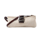 Fendi Baguette shoulder bag in beige Zucca canvas with dark brown leather trim, slim adjustable strap and silver-tone FF buckle.