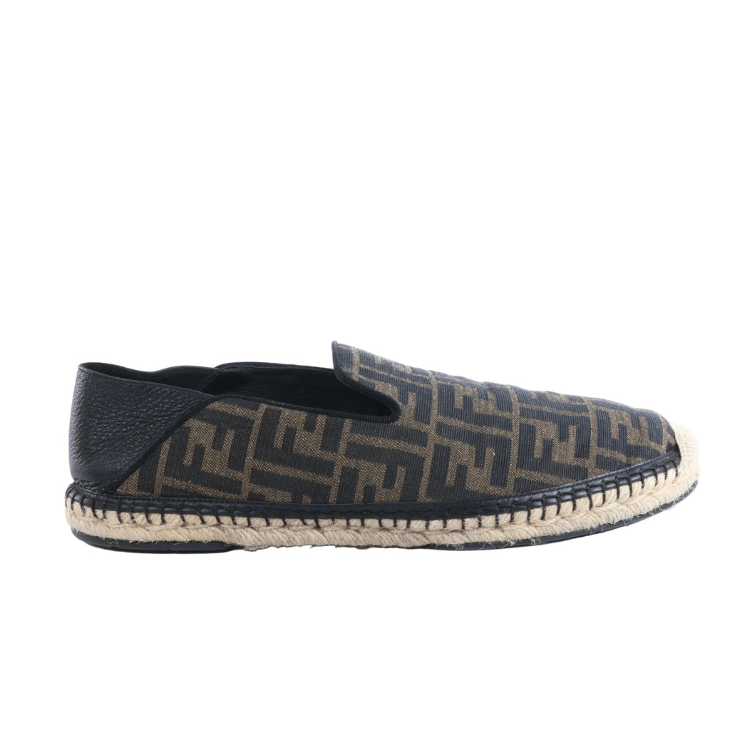 Fendi brown and black FF monogram fabric espadrille with black leather heel panel and woven rope sole on a white background.