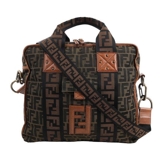 FENDI Zucca Canvas x Leather 2Way Handbag 7VA158 in brown FF monogram canvas with tan leather accents, dual top handles, adjustable logo strap, and front leather "FF" patch, displayed upright against a white background.