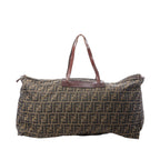 Fendi Zucca FF monogram canvas travel bag with brown leather top handles and zip-top closure on white background.