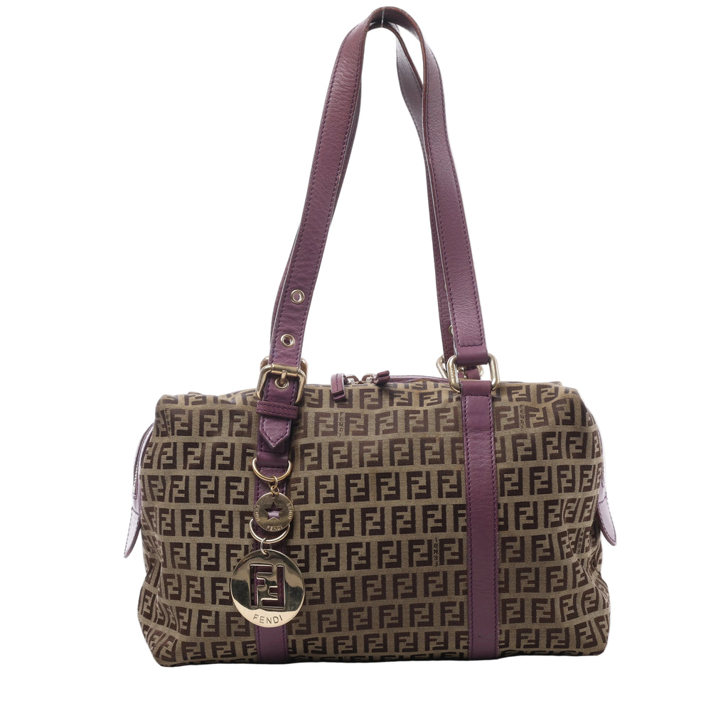 Brown Fendi Zucchino canvas shoulder bag with repeating FF pattern, purple leather handles and trim, and gold-tone Fendi logo charms.