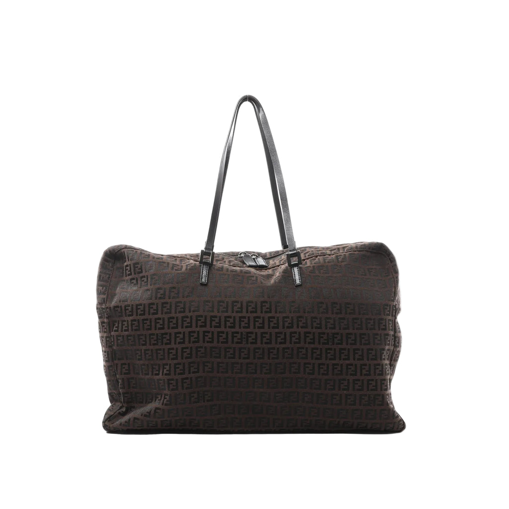 Brown Fendi Zucchino logo canvas tote handbag with repeating FF pattern, black leather shoulder straps, and top zipper closure, shown on a white background.