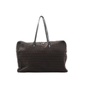 Brown Fendi Zucchino logo canvas tote handbag with repeating FF pattern, black leather shoulder straps, and top zipper closure, shown on a white background.