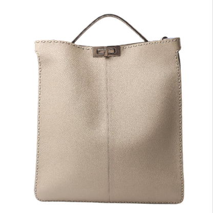 Beige leather handbag with a sleek, minimalist silhouette and signature twist-lock closure.