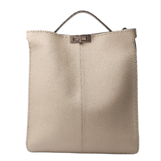 Beige leather handbag with a sleek, minimalist silhouette and signature twist-lock closure.