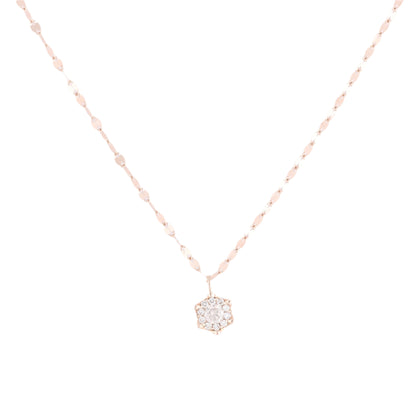 Close-up of an unsigned 18k rose gold necklace with a hexagon-shaped pendant set with 11 natural round diamonds, displayed on a white background.