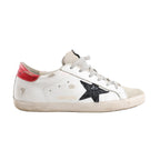 Golden Goose Super-Star Leather Sneakers in white with black glitter star patch, red heel tab, grey laces, and intentionally distressed detailing on the sole and upper, Size 40 EU, displayed in a side profile against a white background.