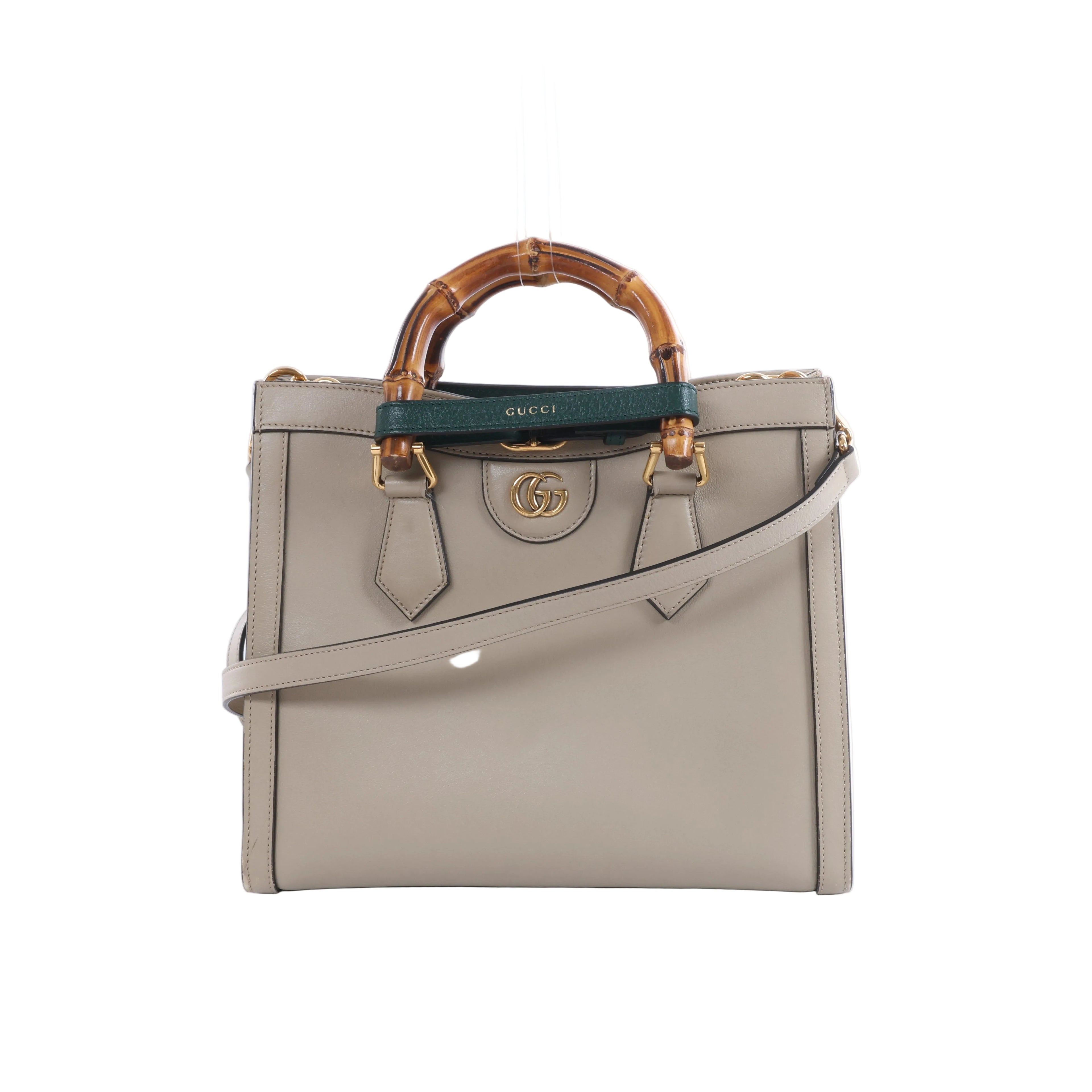 Beige Gucci Bamboo Diana leather handbag with bamboo top handles, green and red handle bands, gold-tone hardware and a detachable shoulder strap.
