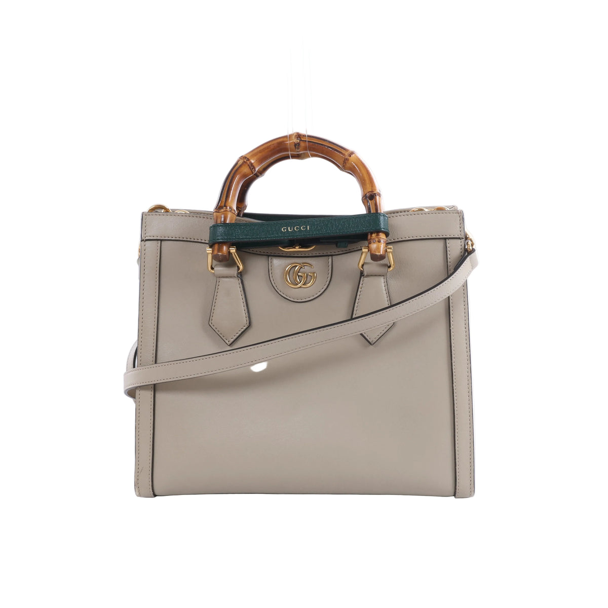 Beige Gucci Bamboo Diana leather handbag with bamboo top handles, green and red handle bands, gold-tone hardware and a detachable shoulder strap.