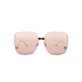 Gucci GG0352S 002 rimless oversized sunglasses with light brown tinted lenses, gold-tone bridge, and small gold corner details on a white background.