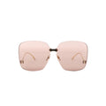 Gucci GG0352S 002 rimless oversized sunglasses with light brown tinted lenses, gold-tone bridge, and small gold corner details on a white background.