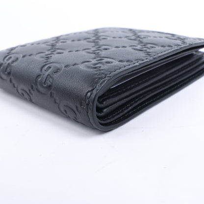 Portefeuille compact en cuir noir Gucci Guccissima 212185