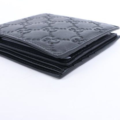 Portefeuille compact en cuir noir Gucci Guccissima 212185