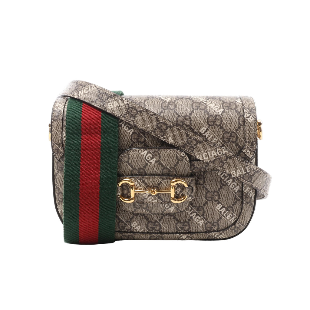 Beige Gucci x Balenciaga monogram crossbody bag with BALENCIAGA print, gold-tone Horsebit hardware and green-red striped shoulder strap.