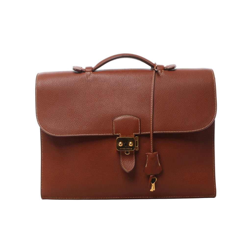 Brown Hermès Sac à Dépêches 38 leather briefcase with top handle, flap closure, gold-tone lock, key and leather clochette.