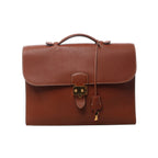 Brown Hermès Sac à Dépêches 38 leather briefcase with top handle, flap closure, gold-tone lock, key and leather clochette.