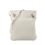 Hermès Aline Mini leather crossbody bag with slim shoulder strap, softly structured pouch shape and silver-tone hardware on a white background.