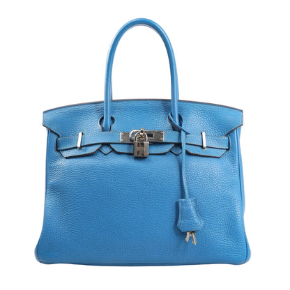 Hermès Birkin 30 handbag in vibrant Mykonos blue Taurillon Clemence leather featuring dual rolled handles, palladium hardware, front flap with lock and key clochette, and signature belted design.