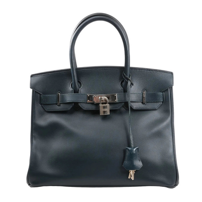 Hermès Birkin 30 handbag in navy blue Veau Epsom leather with dual rolled handles, palladium-tone hardware, front flap, lock and key clochette, and signature belted closure.