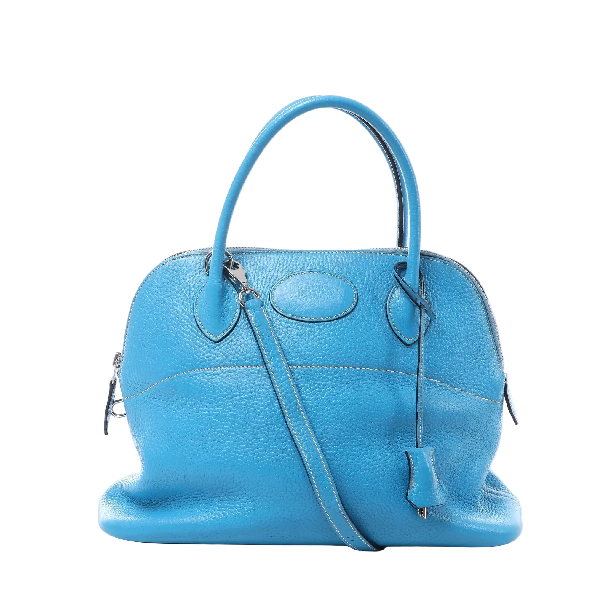 Hermès Bolide 31 bright blue pebbled leather handbag with rounded top handles, shoulder strap, clochette, zip closure, and silver-tone hardware on white background.
