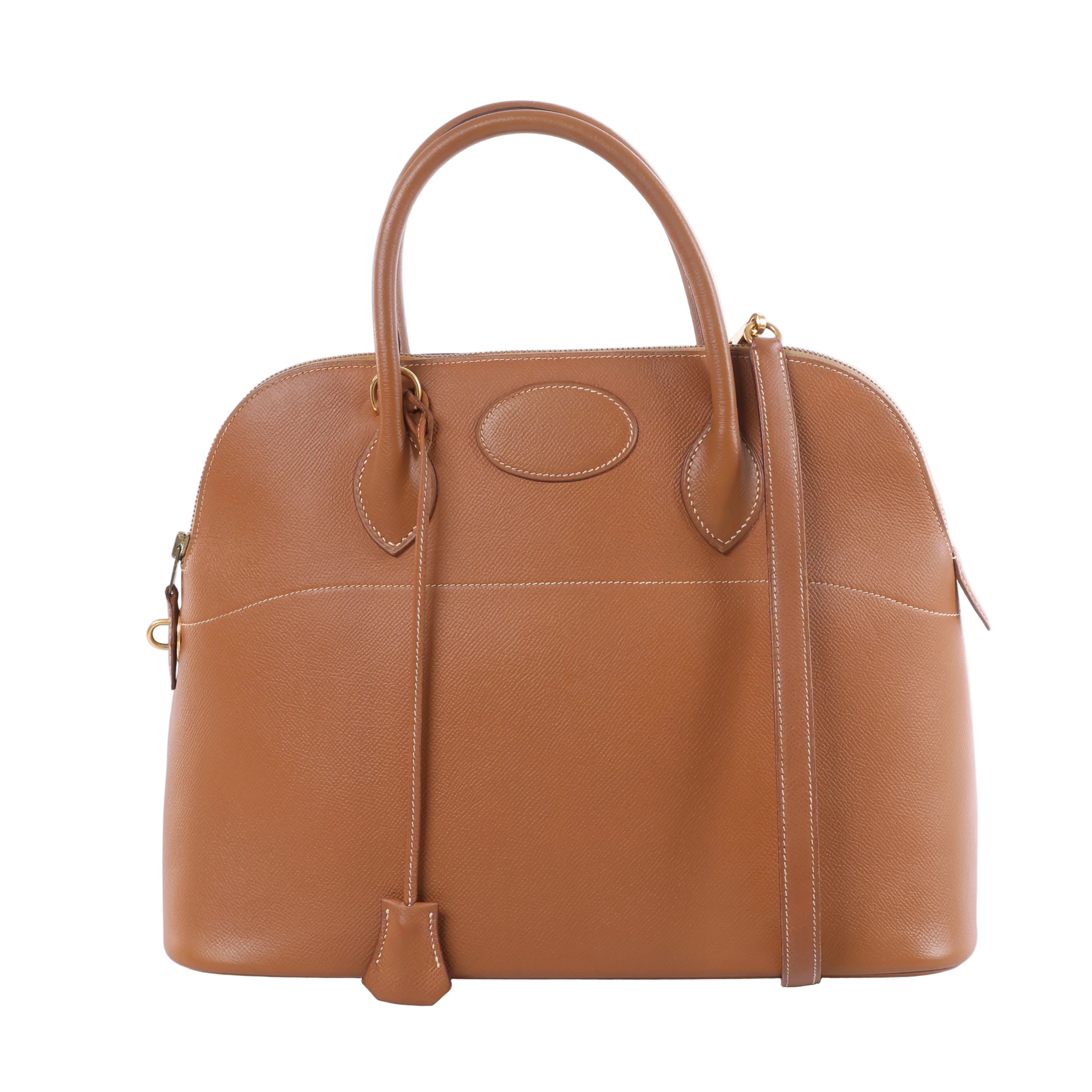 Hermès Bolide 35 brown textured leather handbag with rounded top handles, gold-tone hardware and matching shoulder strap.
