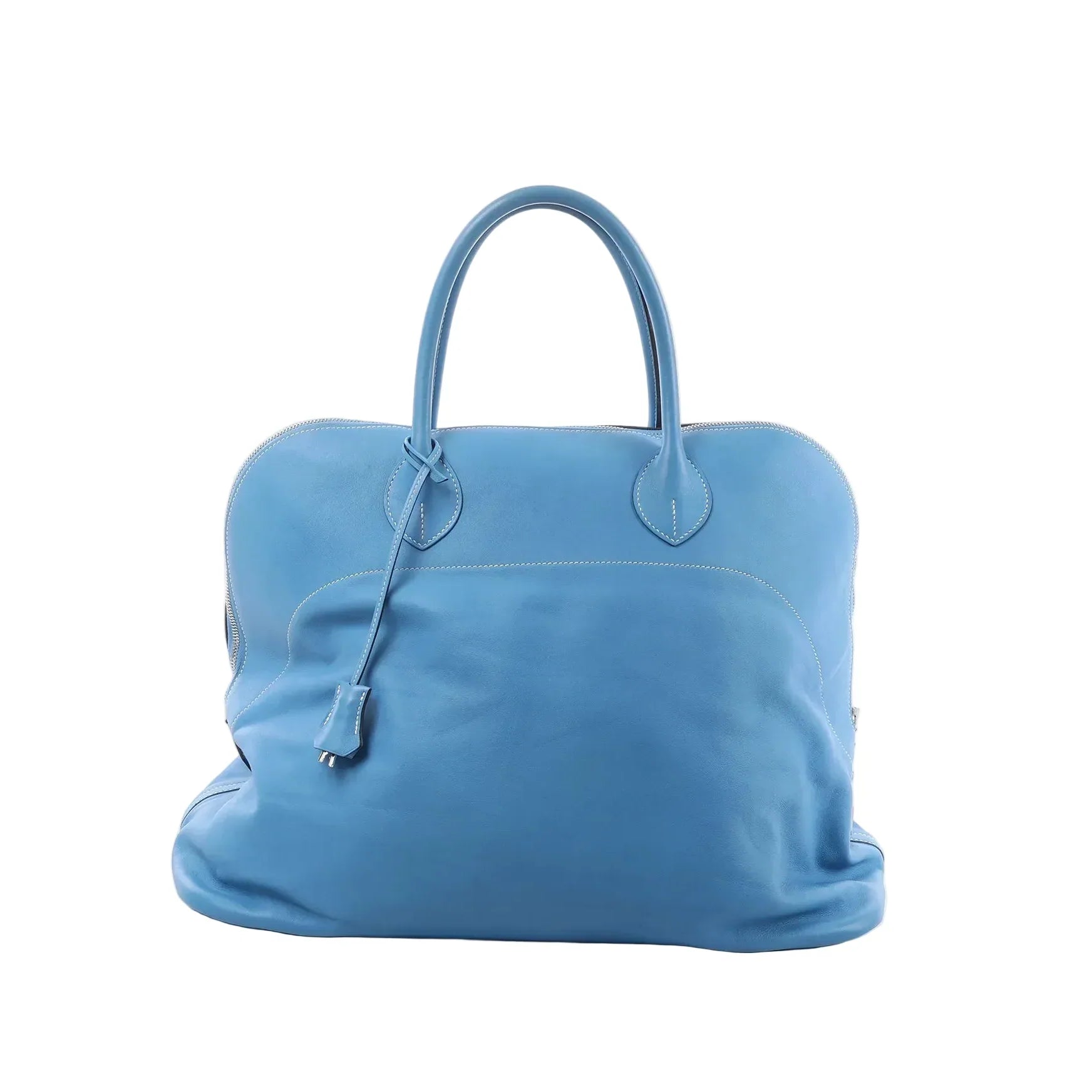 Hermès Bolide Relax 45 handbag in azure blue leather with top handles, zip-around closure, and hanging clochette on a white background.