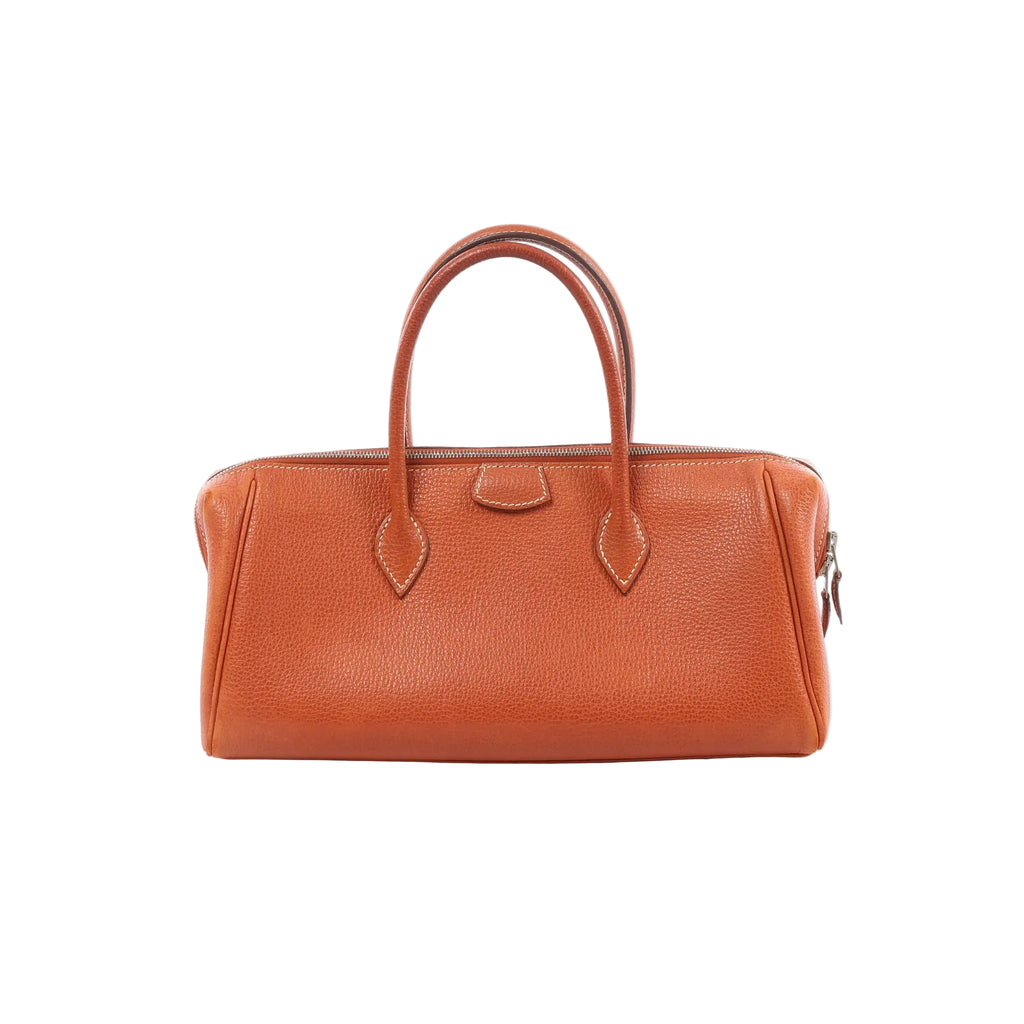 Hermès Bombay 27 handbag in brique brown textured leather with double top handles and a zip-top closure.