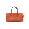 Hermès Bombay 27 handbag in brique brown textured leather with double top handles and a zip-top closure.