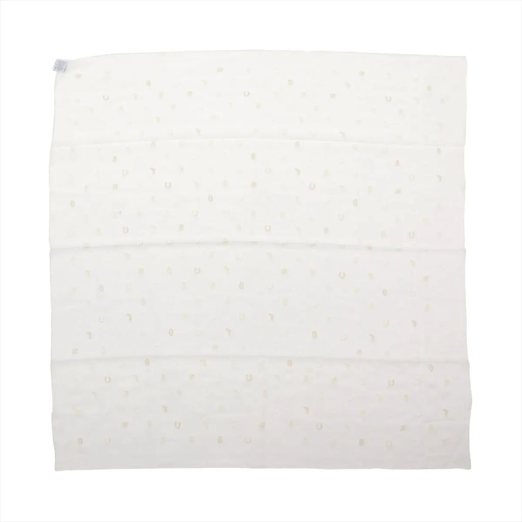 Hermès Carré 100 "Multicharms" silk scarf in white with small, subtle charm motifs evenly patterned across the fabric.