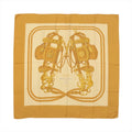 Hermès Carré 140 “Brides de Gala” silk scarf in brown tones with large central bridle and tack illustration on a cream ground and brown border.