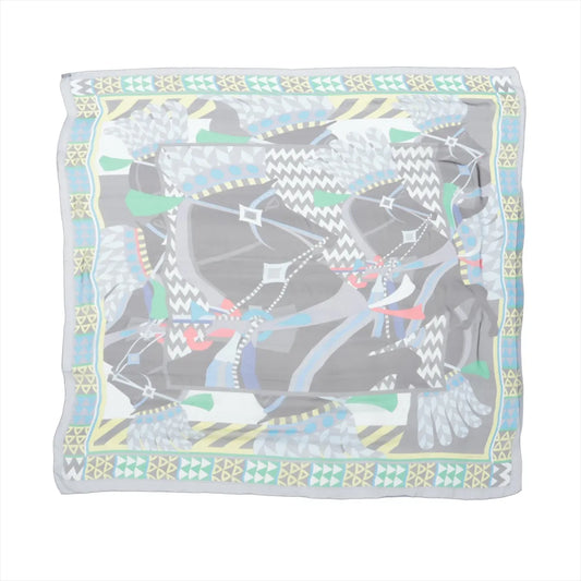 Hermès Carré 140 "Chevaux de Karnak" silk handkerchief in gray featuring abstract horse illustrations with colorful geometric patterns and a decorative border.