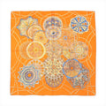 Hermès Carré 90 "LES DÔMES CÉLESTES" silk scarf in bright orange featuring detailed circular dome illustrations in blue, gold, and earth tones, arranged in a celestial-inspired layout.