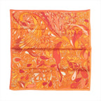 Orange Hermès Carré 70 silk scarf with intricate floral-inspired pattern in coral, yellow, peach and cream tones.