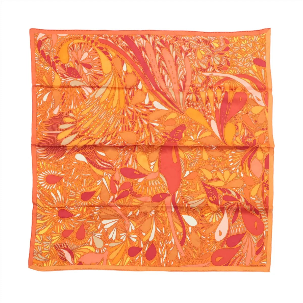 Orange Hermès Carré 70 silk scarf with intricate floral-inspired pattern in coral, yellow, peach and cream tones.