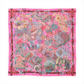 Pink Hermès Carré 90 silk scarf laid flat with intricate multicolor illustrated pattern and decorative border, shown on a white background.