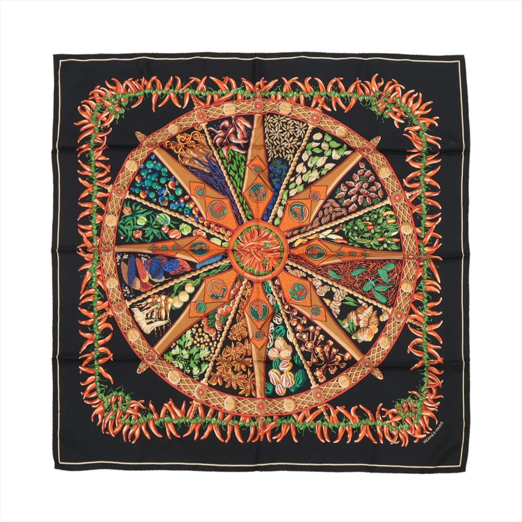 Hermès Carré 90 “Aux Pays des Épices” silk scarf in black with multicolor spice wheel motif and red chili pepper border.